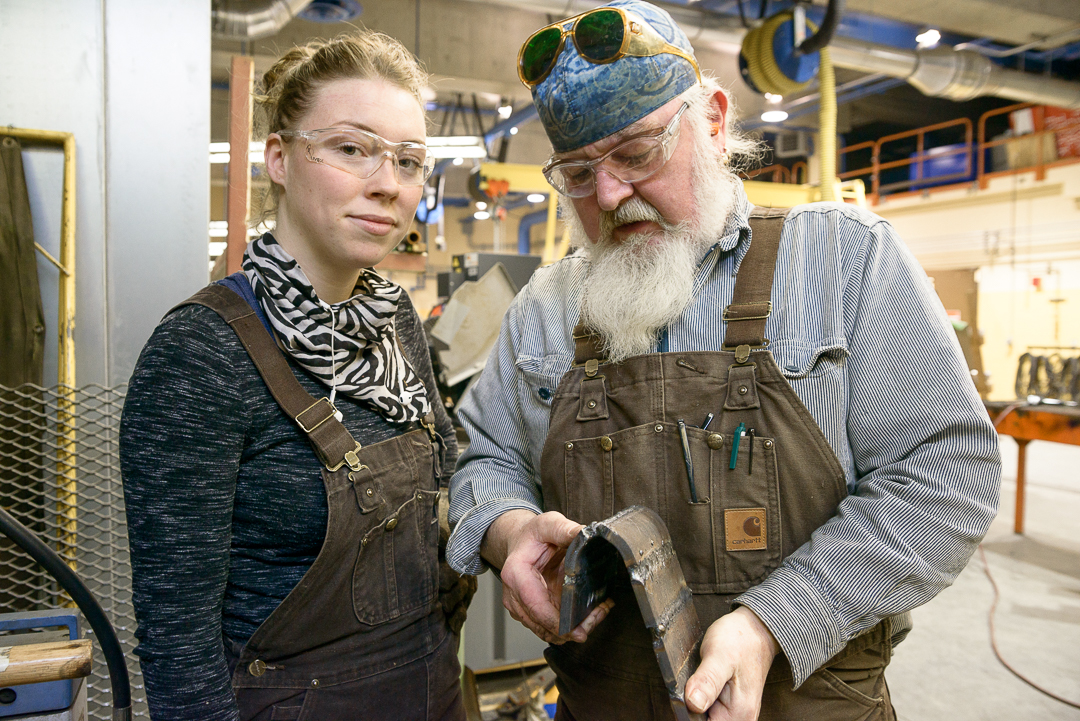Welding student and instructor