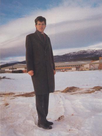 Aron Senkpiel standing before new Yukon College campus in 1988